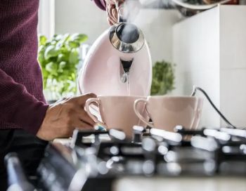 CUSTOMER PREPARING CUP OF TEA BOILING KETTLE 1